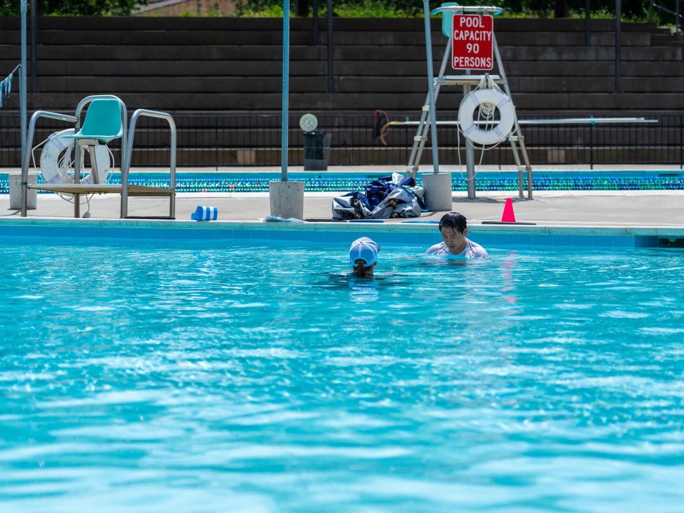 A SWAG instructor working one-on-one with a participant in the pool