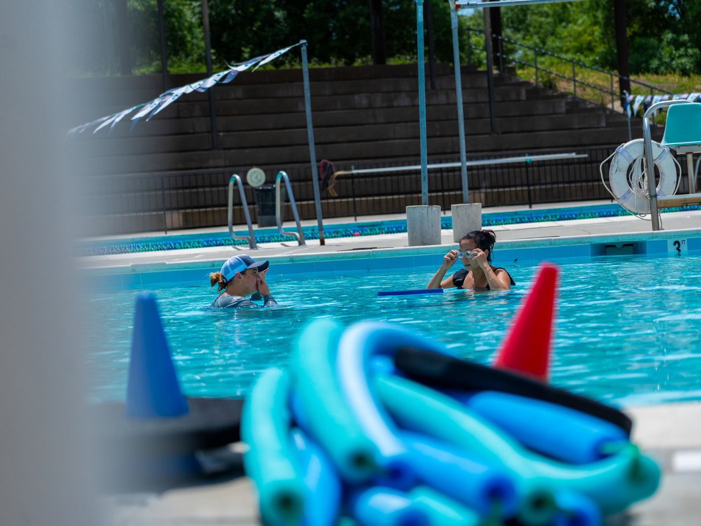 A SWAG instructor guiding a participant through a water safety skill